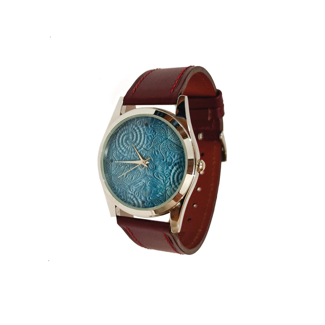 Rellotge de canell blau abstracte amb corretja de pell marró